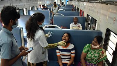 A healthcare worker collects a swab sample of a girl for the Covid-19 test inside a train compartment, in Bengaluru. The Supreme Court on Friday refused to entertain plea against Karnataka govt’s move to limit inter-state travel due to Covid. (ANI) A healthcare worker collects a swab sample of a girl for the Covid-19 test inside a train compartment, in Bengaluru. The Supreme Court on Friday refused to entertain plea against Karnataka govt’s move to limit inter-state travel due to Covid. (ANI)