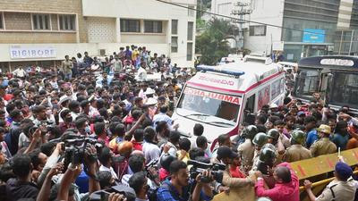 Fans gather outside the Vikram Hospital after Kannada superstar Puneeth Rajkumar passed away, in Bengaluru on Friday. PM Modi, politicians from across party lines, film celebrities paid rich tributes. (PTI) Fans gather outside the Vikram Hospital after Kannada superstar Puneeth Rajkumar passed away, in Bengaluru on Friday. PM Modi, politicians from across party lines, film celebrities paid rich tributes. (PTI)