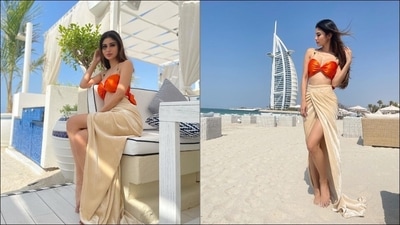 Mouni Roy makes jaws drop in orange bralette, thigh slit beige skirt at Dubai (Instagram/imouniroy) Mouni Roy makes jaws drop in orange bralette, thigh slit beige skirt at Dubai (Instagram/imouniroy)
