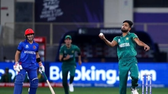 Pakistan's Haris Rauf, right, celebrates after taking the catch to dismiss Afghanistan's Asghar Afghan during the Cricket Twenty20 World Cup match between Pakistan and Afghanistan in Dubai, UAE, Friday, Oct. 29, 2021. (AP Photo/Aijaz Rahi)(AP)