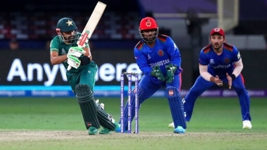 Pakistan's captain Babar Azam, left, bats during the Cricket Twenty20 World Cup match between Pakistan and Afghanistan in Dubai, UAE, Friday, Oct. 29, 2021. (AP Photo/Aijaz Rahi)(AP)