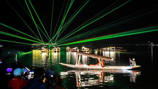 A recent photo of a laser show at Srinagar’s iconic Dal Lake. The Jammu and Kashmir administration has ordered the premature retirement of eight employees. (PTI/File)