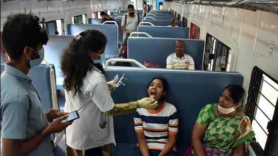 A healthcare worker collects a swab sample of a girl for the Covid-19 test inside a train compartment, in Bengaluru. The Supreme Court on Friday refused to entertain plea against Karnataka govt’s move to limit inter-state travel due to Covid. (ANI) A healthcare worker collects a swab sample of a girl for the Covid-19 test inside a train compartment, in Bengaluru. The Supreme Court on Friday refused to entertain plea against Karnataka govt’s move to limit inter-state travel due to Covid. (ANI)