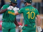 South Africa's Kagiso Rabada, left, and teammate David Miller gesture during the Cricket Twenty20 World Cup match between South Africa and Sri Lanka in Sharjah, UAE, Saturday, Oct. 30, 2021. (AP Photo/Kamran Jebreili)