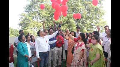 Red balloons being released into the sky during the awareness programme on TB at Lucknow University.