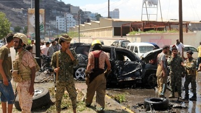 Yemeni security forces and rescue teams gather around the carcass of a burnt car following an explosion that hit Yemen's southern port city of Aden in this representative photo. (AFP) Yemeni security forces and rescue teams gather around the carcass of a burnt car following an explosion that hit Yemen's southern port city of Aden in this representative photo. (AFP)