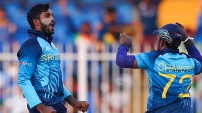Sri Lanka's Wanindu Hasaranga, left, celebrates with teammate Charith Asalanka after taking the wicket of South Africa's Temba Bavuma during the Twenty20 World Cup match between South Africa and Sri Lanka in Sharjah, UAE, Saturday, (AP) Sri Lanka's Wanindu Hasaranga, left, celebrates with teammate Charith Asalanka after taking the wicket of South Africa's Temba Bavuma during the Twenty20 World Cup match between South Africa and Sri Lanka in Sharjah, UAE, Saturday, (AP)