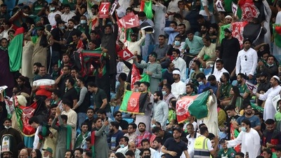 Afghanistan fans cheer for their team during the Cricket Twenty20 World Cup match between Pakistan and Afghanistan in Dubai, UAE, Friday, Oct. 29, 2021. (AP) Afghanistan fans cheer for their team during the Cricket Twenty20 World Cup match between Pakistan and Afghanistan in Dubai, UAE, Friday, Oct. 29, 2021. (AP)