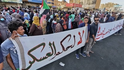 Sudanese anti-coup protesters gather in a street in the capital Khartoum on October 30, 2021, to express their support for the country's democratic transition which a military takeover and deadly crackdown derailed.&nbsp; (AFP)