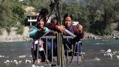 Voters cross a river to cast their vote in the Mandi Lok Sabha bypoll, in Kullu district on Saturday. (Aqil Khan/Hindustan Times) Voters cross a river to cast their vote in the Mandi Lok Sabha bypoll, in Kullu district on Saturday. (Aqil Khan/Hindustan Times)