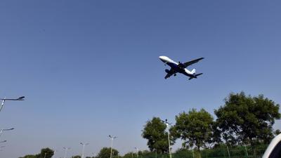 An aircraft in flight under clear blue sky, near Airport T3, in New Delhi, India. (Sanjeev Verma/HT PHOTO)