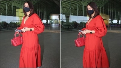Ileana accessorised the red dress with white lace-up sneakers, a gold strap watch, earrings, and animal print retro-style sunglasses. She also carried a red top-handle Valentino bag, adorned came with metallic studs, with the attire. (HT Photo/Varinder Chawla) Ileana accessorised the red dress with white lace-up sneakers, a gold strap watch, earrings, and animal print retro-style sunglasses. She also carried a red top-handle Valentino bag, adorned came with metallic studs, with the attire. (HT Photo/Varinder Chawla)