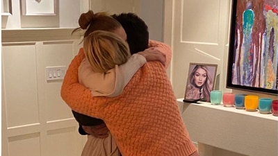 Gigi Hadid, Zayn Malik and Yolanda Hadid embracing each other after Khai's birth.