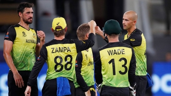 Cricket - ICC Men's T20 World Cup - Super 12 - Group 1 - Australia v England - Dubai International Stadium, Dubai, United Arab Emirates - October 30, 2021 Australia's Matthew Wade and Ashton Agar celebrate with teammates after taking the wicket off England's Dawid Malan REUTERS/Hamad I Mohammed(REUTERS)
