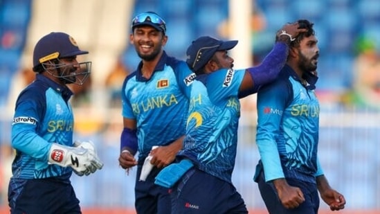 Sri Lanka's Wanindu Hasaranga, right, is congratulated by teammates after taking the wicket of South Africa's Aiden Markram during the Cricket Twenty20 World Cup match between South Africa and Sri Lanka in Sharjah, UAE, Saturday, Oct. 30, 2021. (AP Photo/Kamran Jebreili)(AP)