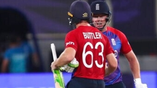 England's Jos Buttler and Jonny Bairstow celebrate their team win against Australia during the Cricket Twenty20 World Cup match in Dubai, UAE, Saturday, Oct. 30, 2021. (AP Photo/Aijaz Rahi)(AP)