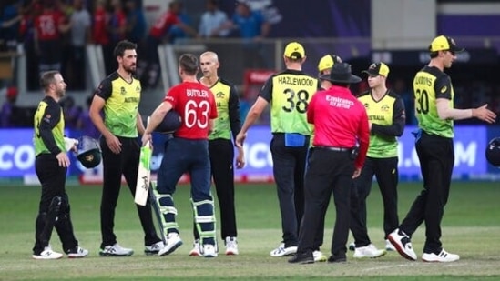 Australian players congratulate England's Jos Buttler during the Cricket Twenty20 World Cup match after England's win, in Dubai, UAE, Saturday, Oct. 30, 2021. (AP Photo/Aijaz Rahi)(AP)