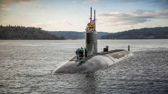 A Navy official says a submarine that collided with an unknown underwater object in the South China Sea has arrived in port at Guam. The Navy says the USS Connecticut was conducting routine operations when it struck the object on Oct. 2. (US Navy via AP)