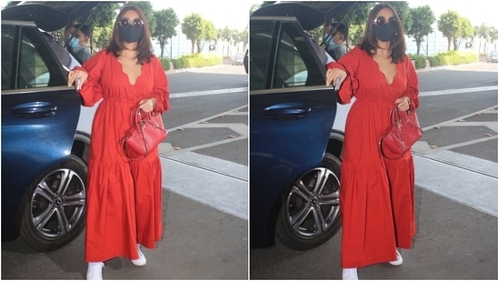 Ileana looked stunning in the bright red midi dress as she arrived at the Mumbai airport. Her ankle-length dress featured a fit-and-flare silhouette along with tiers on the skirt. The gathered balloon sleeves and the ill-fitting of the dress made it a perfect choice for a long flight.(HT Photo/Varinder Chawla)