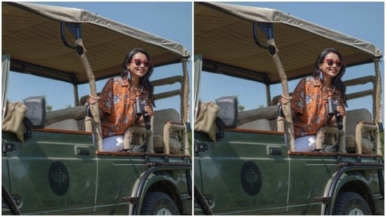 Ankita looked chic in a printed shirt as she perched up on a gypsy, geared with her binoculars to spot wildlife in their natural habitat.(Instagram/@ankita_earthy)