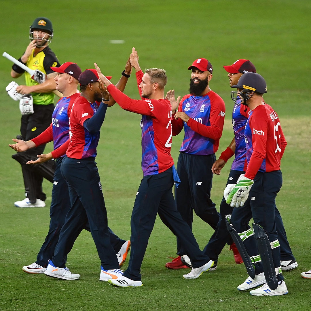 Players celebrate a wicket during the ICC Men's Twenty20 World Cup 2021 cricket match between England and Australia, at Dubai International Cricket Stadium, in Dubai on Saturday. (ANI ) Players celebrate a wicket during the ICC Men's Twenty20 World Cup 2021 cricket match between England and Australia, at Dubai International Cricket Stadium, in Dubai on Saturday. (ANI )
