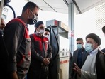Iranian President Ebrahim Raisi speaks with gas station workers in Tehran, Iran.(AP) Iranian President Ebrahim Raisi speaks with gas station workers in Tehran, Iran.(AP)