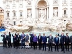 G20 leaders throw a coin in the water during a visit to the Trevi fountain in central Rome.(AP) G20 leaders throw a coin in the water during a visit to the Trevi fountain in central Rome.(AP)