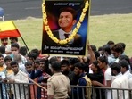 Fans holding a poster of actor Puneeth Rajkumar gather outside Sree Kanteerava Stadium to pay their last respect in Bengaluru. (ANI Photo) Fans holding a poster of actor Puneeth Rajkumar gather outside Sree Kanteerava Stadium to pay their last respect in Bengaluru. (ANI Photo)