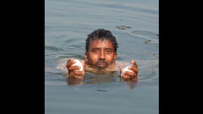 Daily wager Laxman with the ghariyal eggs Daily wager Laxman with the ghariyal eggs