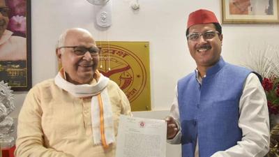 Samajwadi Party MLA from Gauriganj seat in Amethi Rakesh Pratap Singh handing over his resignation letter to UP assembly speaker Hriday Narayan Dikshit at his residence in Lucknow on Sunday. (PTI Photo) Samajwadi Party MLA from Gauriganj seat in Amethi Rakesh Pratap Singh handing over his resignation letter to UP assembly speaker Hriday Narayan Dikshit at his residence in Lucknow on Sunday. (PTI Photo)