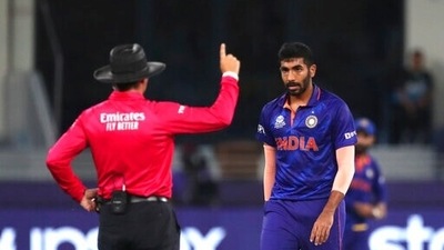 Umpire gestures after India's Jasprit Bumrah , right, made a wide delivery during the Cricket Twenty20 World Cup match between New Zealand and India in Dubai, UAE, Sunday, Oct. 31, 2021. (AP Photo/Aijaz Rahi) (AP) Umpire gestures after India's Jasprit Bumrah , right, made a wide delivery during the Cricket Twenty20 World Cup match between New Zealand and India in Dubai, UAE, Sunday, Oct. 31, 2021. (AP Photo/Aijaz Rahi) (AP)
