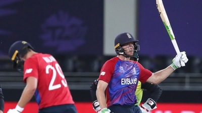 England's Jos Buttler,right celebrates his 50 runs during the Cricket Twenty20 World Cup match between Australia and England in Dubai, UAE, Saturday, Oct. 30, 2021. (AP Photo/Aijaz Rahi) (AP) England's Jos Buttler,right celebrates his 50 runs during the Cricket Twenty20 World Cup match between Australia and England in Dubai, UAE, Saturday, Oct. 30, 2021. (AP Photo/Aijaz Rahi) (AP)
