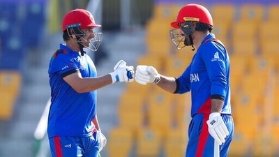 Afghanistan's Asghar Afghan, left, gestures to teammate Mohammad Nabi during the Cricket Twenty20 World Cup match between Afghanistan and Namibia in Abu Dhabi, UAE. (AP) Afghanistan's Asghar Afghan, left, gestures to teammate Mohammad Nabi during the Cricket Twenty20 World Cup match between Afghanistan and Namibia in Abu Dhabi, UAE. (AP)