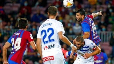 Barcelona's Sergio Aguero, top right, heads the ball during the La Liga soccer match between Barcelona and Alaves at the Camp Nou stadium in Barcelona, Spain Saturday, Oct. 30, 2021. (AP Photo/Joan Monfort) (AP) Barcelona's Sergio Aguero, top right, heads the ball during the La Liga soccer match between Barcelona and Alaves at the Camp Nou stadium in Barcelona, Spain Saturday, Oct. 30, 2021. (AP Photo/Joan Monfort) (AP)