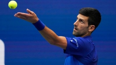 Novak Djokovic of Serbia serves to Daniil Medvedev of Russia in the men's singles final on day fourteen of the 2021 U.S. Open tennis tournament at USTA Billie Jean King National Tennis Center. Mandatory Credit: Robert Deutsch (USA TODAY Sports)