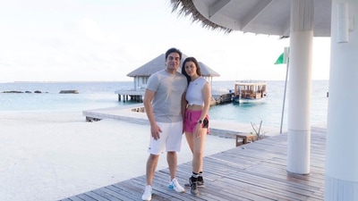 Arbaaz and Giorgia posing for a picture by the ocean. Arbaaz and Giorgia posing for a picture by the ocean.