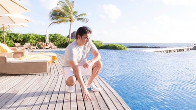 Arbaaz posing on the deck, next to his resort's swimming pool. Arbaaz posing on the deck, next to his resort's swimming pool.