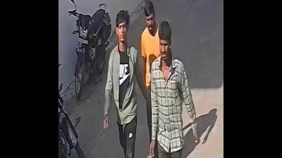 A video grab from the CCTV footage showing three of the four robbers who were involved in a robbery bid in Ludhiana. (HT Photo)