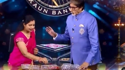 Amitabh Bachchan plays a game with contestant Ruchi. Amitabh Bachchan plays a game with contestant Ruchi. 