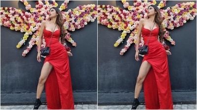 Mouni wore a smoking hot silk-satin dress for the festival of scares. Her strapless attire comes in a bright red shade and a figure-flattering silhouette that accentuated her svelte frame nicely. (Instagram/@imouniroy) Mouni wore a smoking hot silk-satin dress for the festival of scares. Her strapless attire comes in a bright red shade and a figure-flattering silhouette that accentuated her svelte frame nicely. (Instagram/@imouniroy)