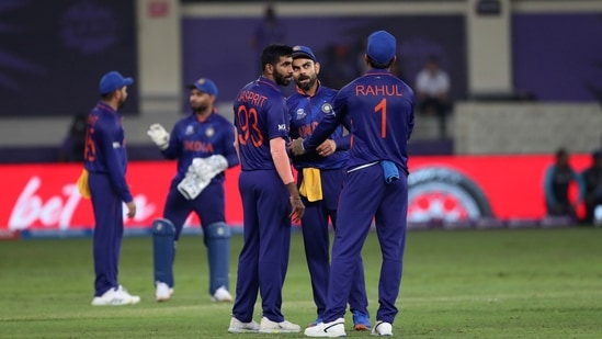 Indian cricket captain Virat Kohli, second right, talks to teammates during the last few overs of the Cricket Twenty20 World Cup match between India and Pakistan in Dubai, UAE, Sunday, Oct. 24, 2021. (AP)