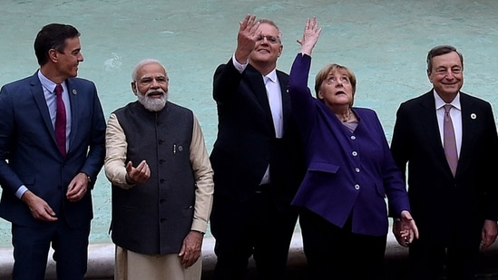 Prime Minister Narendra Modi and other G20 leaders throw a coin in the water during a visit to the Trevi fountain in central Rome.(AFP) Prime Minister Narendra Modi and other G20 leaders throw a coin in the water during a visit to the Trevi fountain in central Rome.(AFP)