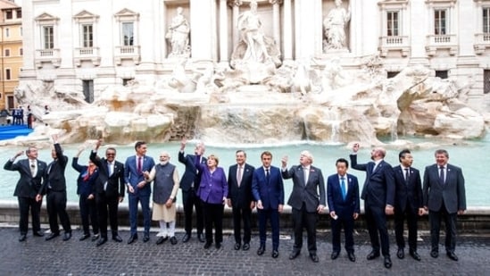 G20 leaders throw a coin in the water during a visit to the Trevi fountain in central Rome.(AP)