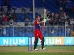 England's Jos Buttler celebrates after scoring a century during the Cricket Twenty20 World Cup match between England and Sri Lanka in Sharjah, UAE, Monday, Nov. 1, 2021. England's Jos Buttler celebrates after scoring a century during the Cricket Twenty20 World Cup match between England and Sri Lanka in Sharjah, UAE, Monday, Nov. 1, 2021.