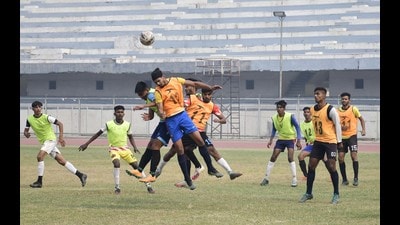 Players in action at Guru Nanak Stadium during trials for the state football team that will participate in Fourth Khelo India Youth Games . (Harsimar Pal Singh/HT)