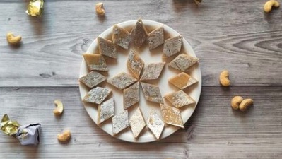 Kaju Katli: You cannot celebrate Diwali without this cashew flavoured dessert. It is made by thickening cashews paste and sugar solution which is then topped with an edible silver foil cut into diamond pieces. (Instagram/@explorewithpranavnair)