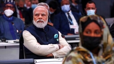 India's Prime Minister Narendra Modi attends the opening ceremony of the UN Climate Change Conference COP26 in Glasgow, Scotland, Monday. (Yves Herman/Pool via AP) (AP) India's Prime Minister Narendra Modi attends the opening ceremony of the UN Climate Change Conference COP26 in Glasgow, Scotland, Monday. (Yves Herman/Pool via AP) (AP)