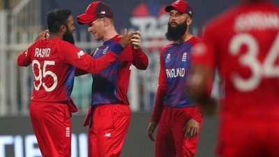 England's Adil Rashid, without cap, celebrates the dismissal of Sri Lanka's Kusal Perera during the Cricket Twenty20 World Cup match between England and Sri Lanka in Sharjah, UAE, Monday, Nov. 1, 2021. (AP) England's Adil Rashid, without cap, celebrates the dismissal of Sri Lanka's Kusal Perera during the Cricket Twenty20 World Cup match between England and Sri Lanka in Sharjah, UAE, Monday, Nov. 1, 2021. (AP)