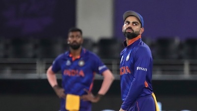 India's captain Virat Kohli reacts to a boundary hit by New Zealand's Daryl Mitchell during the Cricket Twenty20 World Cup match between New Zealand and India in Dubai, UAE, Sunday (AP)