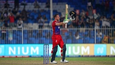 England's Jos Buttler celebrates after scoring a century during the Cricket Twenty20 World Cup match between England and Sri Lanka in Sharjah, UAE, Monday, Nov. 1, 2021. (AP) England's Jos Buttler celebrates after scoring a century during the Cricket Twenty20 World Cup match between England and Sri Lanka in Sharjah, UAE, Monday, Nov. 1, 2021. (AP)